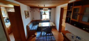 a dining room with a table and chairs in a room at Eckert Ferienhaus Eslarn in Eslarn