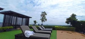 a group of chairs sitting on top of a lawn at Beacon Executive Suites George Town Apartment Malaysia deals in George Town