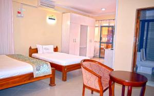 Voodi või voodid majutusasutuse Two Oceans Hotel Voi toas