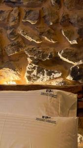 a view of a table with rocks and water at Hanging Terraces المدرجات المعلقة in Al ‘Aqar