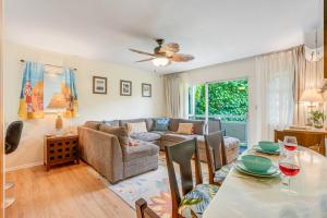 a living room with a table and a couch at Nani Hale in Kapaa