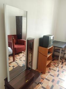 a mirror and a television in a room at Low Budget Economy SingleBed Bedroom in Aman Puri, Kepong in Kuala Lumpur +22 photos