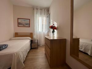 Llit o llits en una habitació de Dos Torres Tenor Gayarre - Encanto con Balcón Interior