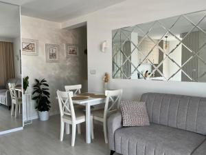 a living room with a table and a couch at Apartament in Bochnia