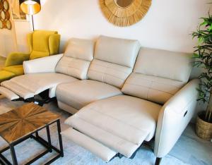 a living room with a couch and a table at Relax at Premium Beach flat - Aldea Beach in Manilva +22 photos