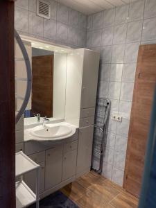 a bathroom with a sink and a mirror at Ferienhaus Murtal in Weißkirchen in Steiermark