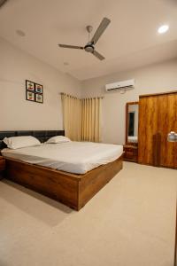 A bed or beds in a room at singing greenz staycations