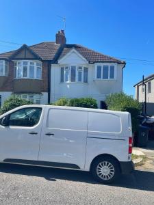 a white van parked in front of a house at Woodfield apartment in The Hyde