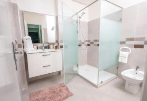 a bathroom with a shower and a sink and a toilet at Tradition Meets Modern: 2BR Flat in Rabat Hassan in Rabat +28 photos