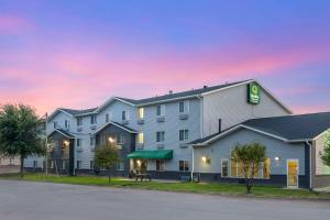 a rendering of a hotel at dusk at Quality Inn & Suites Delaware in Delaware