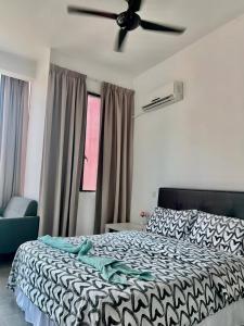 a bedroom with a bed and a ceiling fan at Studio Tower @ Empire Damansara in Petaling Jaya