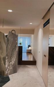 a hallway with a staircase leading to a room at Ekies All Senses Resort, a Member of Design Hotels in Vourvourou