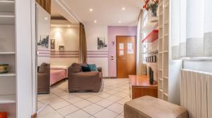 a room with a bed and a chair and a bedroom at MonoliVi 35 - Affitti Brevi Italia in Modena +29 photos