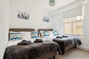 Lova arba lovos apgyvendinimo įstaigoje Luxury Urban Living - 1 BDR