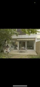 two pictures of a house with a table and a fireplace at se: 13A rue des Touleuses Pourpre in Cergy