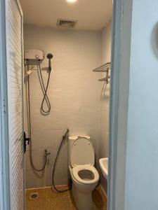 a bathroom with a toilet and a shower at Casa Coco @ La bella, Tagaytay in Tagaytay