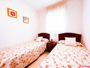 Llit o llits en una habitació de Acapulco Paradise 1era Línea