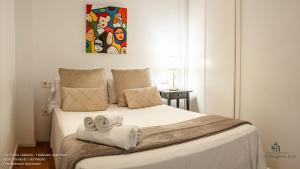 Ένα ή περισσότερα κρεβάτια σε δωμάτιο στο Living4Malaga Calderón de la Barca