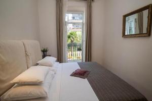Posteľ alebo postele v izbe v ubytovaní Apartmani Marion Crikvenica