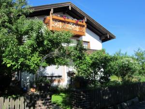 a house with a fence in front of it at Ferienwohnung Enzinger in Teisendorf