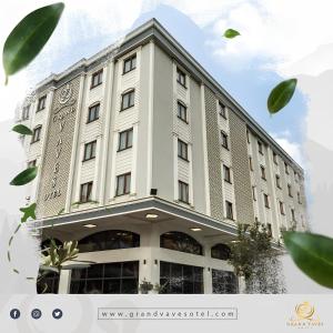 a large white building with a lot of windows at Grand Vaves Hotel in Trabzon