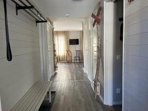 a hallway with a bench in a house at Åre Travel - Mitt i Åre 2 in Åre