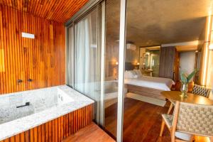 Cama ou camas em um quarto em Duke Beach Hotel Maresias