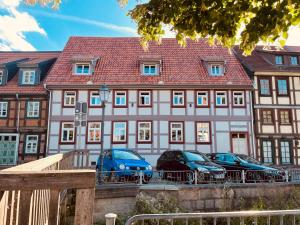 a large building with cars parked in front of it at FourElements in Wernigerode