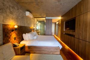 Cama ou camas em um quarto em Duke Beach Hotel Maresias