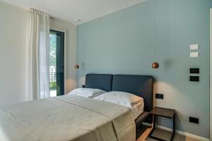 Ein Bett oder Betten in einem Zimmer der Unterkunft Appartamento Midum Family Garden