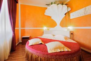 Postel nebo postele na pokoji v ubytování Hotel Benessere Villa Fiorita