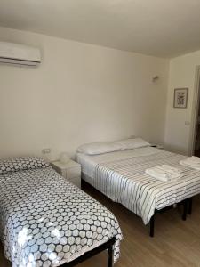 Postel nebo postele na pokoji v ubytování Trulli bella vite