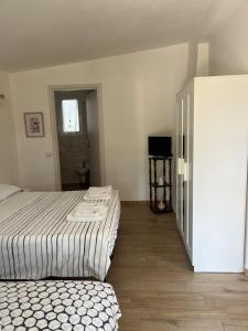 Postel nebo postele na pokoji v ubytování Trulli bella vite
