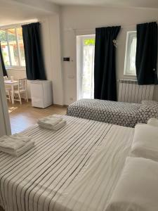 Postel nebo postele na pokoji v ubytování Trulli bella vite