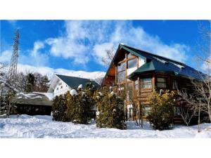 a log cabin in the snow with snow at Hakuba Pension Meteor - Vacation STAY 63342v in Hakuba