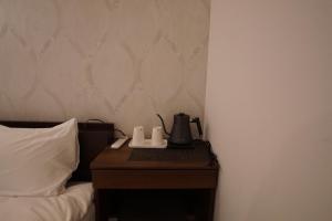 Postel nebo postele na pokoji v ubytování MARUKOU HOTEL