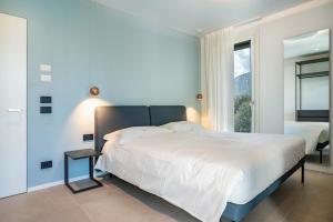 Tempat tidur dalam kamar di Appartamento Midum Balcony Nord