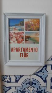 Un segno su un muro che legga l'influenza del tg di Apartamentos das Avós-Flor a Nazaré