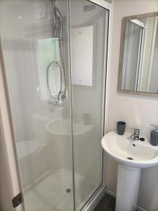 a bathroom with a shower and a sink at Home from home in Hastings