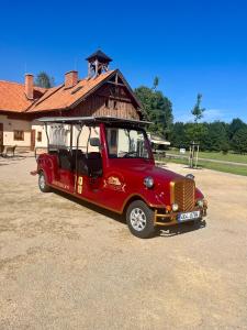 a red van parked in front of a building at Zámeček - Chateau Lány in Břeclav