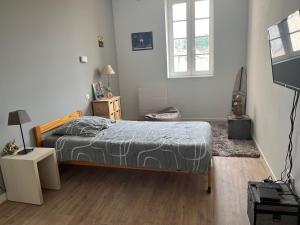 Postel nebo postele na pokoji v ubytování Les chambres du Golf