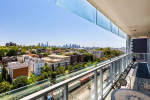 a balcony with a view of a city at City View Chic in South Yarra with Parking in Melbourne