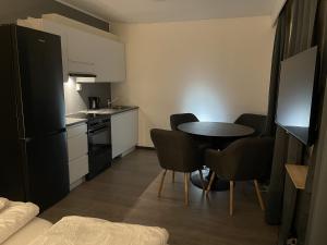 Kuchyň nebo kuchyňský kout v ubytování SamiCity Hotel As