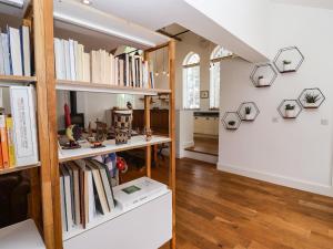 a room filled with shelves filled with books at The Chapel in Alfreton