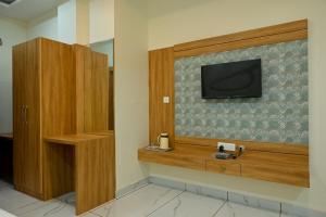 a room with a flat screen tv on a wall at HOTEL VIEW in Govardhan