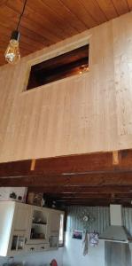 a wooden wall in a room with a ceiling at haut de chalet le Bois de Cerf in Les Angles