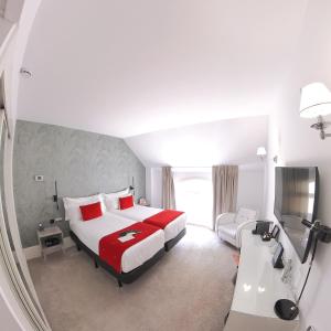 Postel nebo postele na pokoji v ubytování Mariposa Hotel Malaga