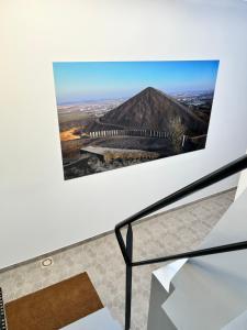 a picture of a pyramid on a wall at Lens Louvre 2 in Lens