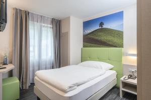 Krevet ili kreveti u jedinici u okviru objekta Adhhoc Hotel