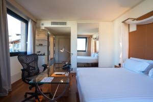 Postel nebo postele na pokoji v ubytování Hilton Garden Inn Florence Novoli